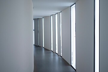 Narrow contemporary hallway with lights and rectangle windows