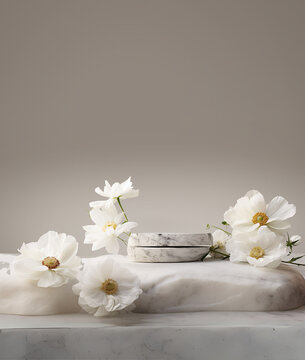 Stone podium for product display with white flowers. Gray showcase mockup