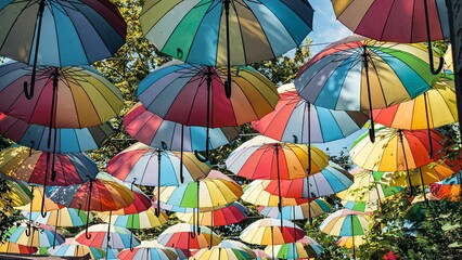 Multi-colored umbrellas hanging above the street in Istanbul on a sunny day