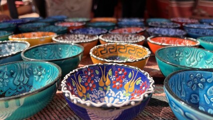 Closeup shot of ornamented plates for sale in Wadi Rum Desert market, Jordan