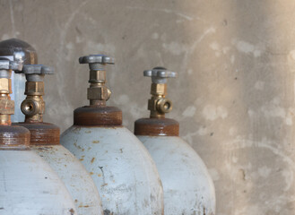 metal oxygen cylinders on a wall background