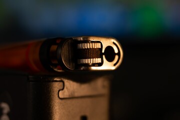Closeup shot of the front of a red lighter