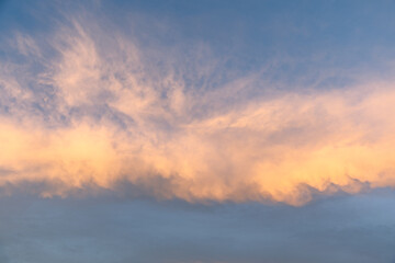 A breathtaking sunset paints the sky with a blend of warm gold and cool blue hues, creating a serene backdrop perfect for enhancing the visual appeal of creative projects