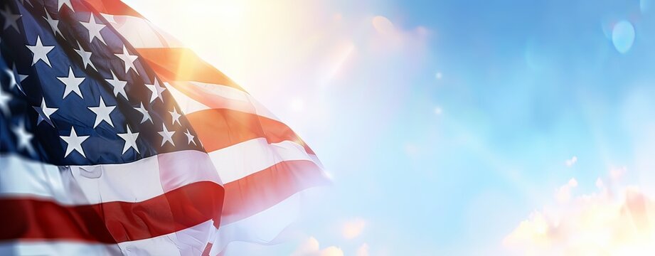 A large American flag is flying in the sky