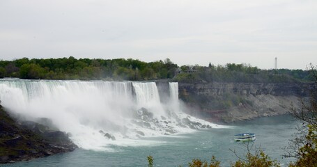 Famous American Falls, Niagara River, showcasing breathtaking beauty. Majesty of American waterfall, cascading with pure power and grace. Spectacle of American Falls in all natural glory.