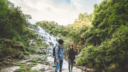 Travel relax to visit the waterfalls of couples. In the winter. at the waterfall mae ya chiangmai...