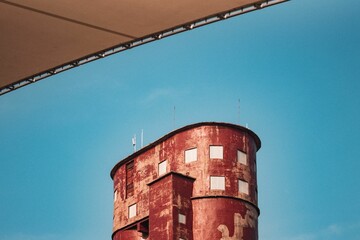 Old damaged building isolated on a blue sky, can be used for wallpaper