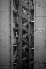 Vertical grayscale of an old building stairway structure