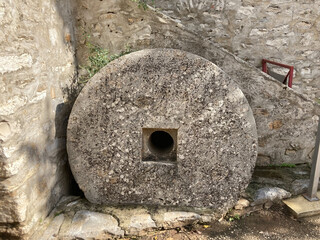 Old olive grinding stone with a hole in the center