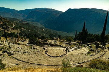 Distant view of the Ancient Theater of Delphi on a sunny day in Ancient Greece