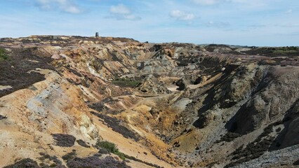 Aerial view of the Parys Mountain with a cloudy blue sky in the background, Wales, United Kingdom