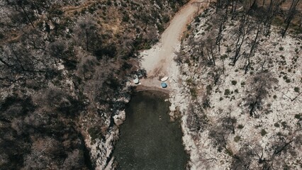 Aerial view of a white wand beach surrounde by trees