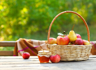 Apples in a basket on wooden table