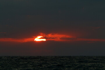 Lighting and color of the sky above the horizon at sunset.