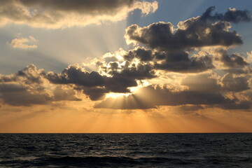 Lighting and color of the sky above the horizon at sunset.