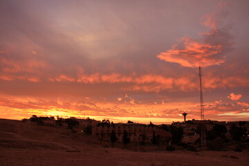 Lighting and color of the sky above the horizon at sunset.
