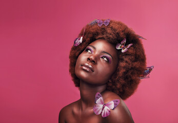 Beauty, cosmetics and black woman with butterflies in studio with creative, art and fantasy....