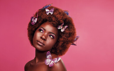 Beauty, makeup and black woman with butterflies in studio with creative, art and fantasy....