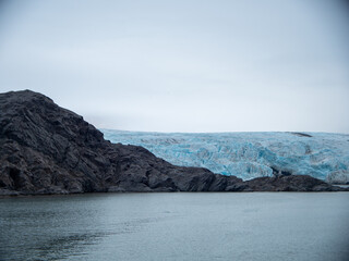 Fototapeta na wymiar Scenic view of beautiful glazier and rocks in Svalbard, Spitsbergen