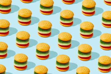 Hamburger junk food pattern on bright blue background. Creative fast food concept.