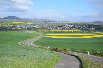 winding road in the Eifel with village Thür