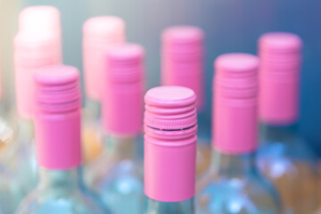 Bottle of wine in pink color, selective focus on the bottle