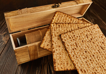 Passover celebration concept - Jewish holiday Passover. Stack of matzo on a wooden background with...
