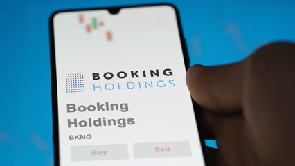 April 09th 2024 , Norwalk, Connecticut. Close up on logo of Booking Holdings on the screen of an exchange. Booking Holdings price stocks, $BKNG on a device.
