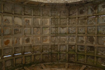 ruins of an abandoned villa in Greek style - ribbed roof vault with remains of painting on a sunny day