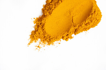 A smear of turmeric on a white background, top view