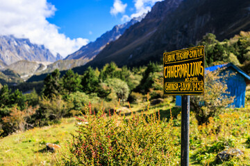 Signpost at Chhermalung (3,740m) on the Kanchenjunga Base Camp trek (and the Great Himalaya trail (GHT)) between the settlements of Ghunsa and Khambachen, Himalaya in Nepal.