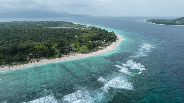 Aerial time lapse of tropical island with beaches and azure blue water at Gili Meno, Lombok, Indonesia