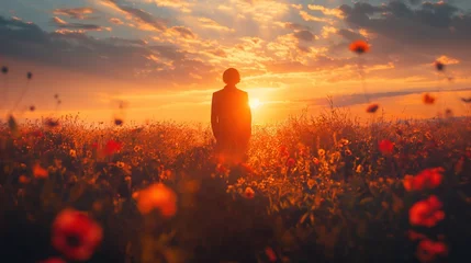 Fotobehang natural beauty scenery of a man standing in poppy flowers blossoming field against sunburst light at morning time, generative Ai  © QuietWord