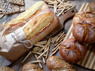 Traditional bread from a Polish bakery - rye buns, buns with sunflower seeds and linseed, grissini...
