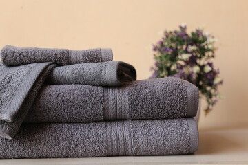 Stack of 2 Gray bath towel with 2 hand towel and 1 wash cloth folded isolated 