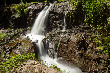 Soothing Waterfalls Captured in Rio Fratta River, Corchiano, Through Long Exposures - obrazy, fototapety, plakaty