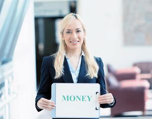 Portrait of a smiling businesswoman with money sign - 783711028