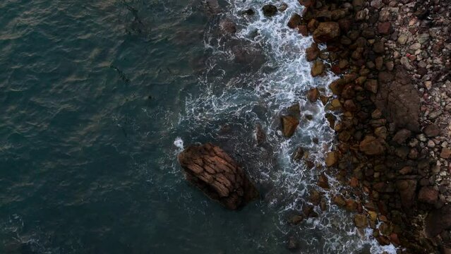 Waves on a rocky coastline in Thailand