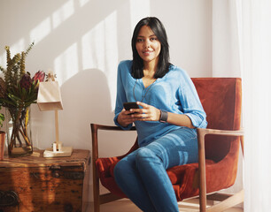 Portrait, smartphone and woman on sofa for networking, social media or mobile app in lounge. Home,...