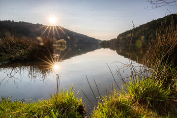 Lake in sunset. Beautiful landscape. Located in the middle of the forest and surrounded by nature,...