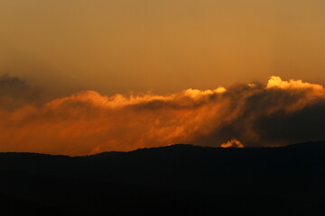 Lighting and color of the sky above the horizon at sunset.