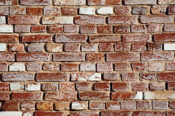 in the photo there is a close-up of an old brick wall