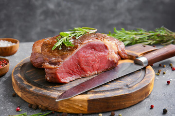 Fresh steak on cutting board with knife - 783741246