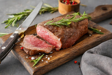 Fresh steak on cutting board with knife - 783741274