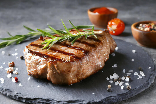 Ready grilled steak on cutting board
