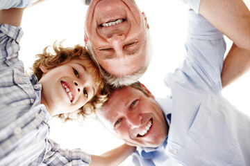 Portrait of grandpa, dad and child in circle for bonding, relationship and generations. Family home, happy and huddle of grandfather, father and young boy for love, relax and fun together on weekend