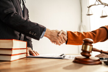 Shaking hands signifies mutual agreement and professionalism. It embodies the essence of justice,...