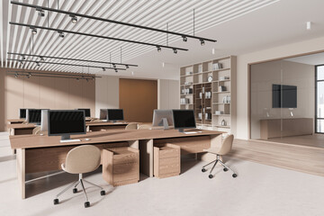 Stylish business interior with pc computers on desk, shelf with panoramic window