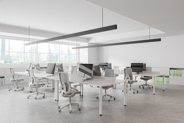 Luxury office coworking interior with pc desktop on tables in row, window