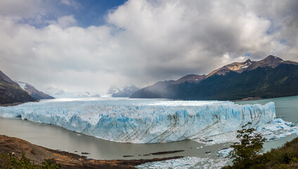 Majestic Glacier View Amidst Mountains and Cloudy Sky